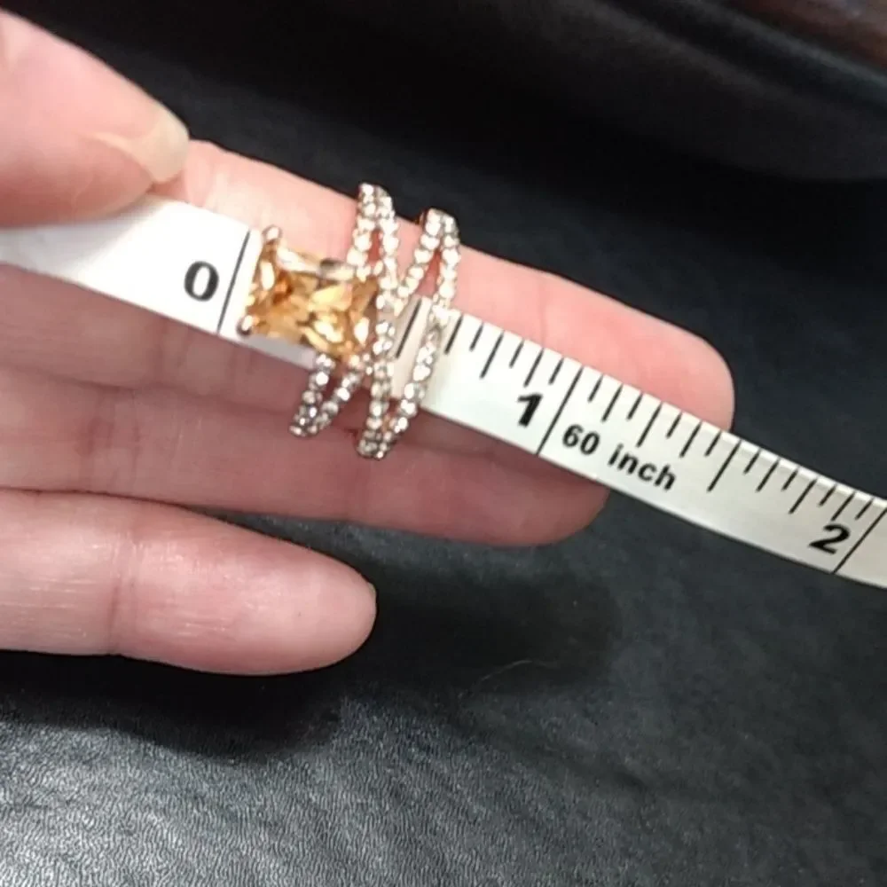 Rose gold colored ring with champagne stone Size 6